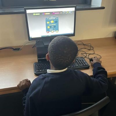Consolidating our maths work in the Computer Room.