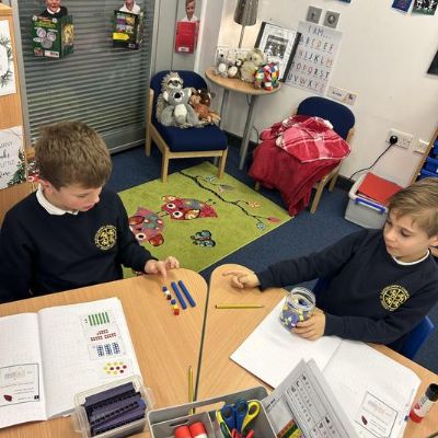 Adding across 10 by using our number bonds to exchange ones for tens.
