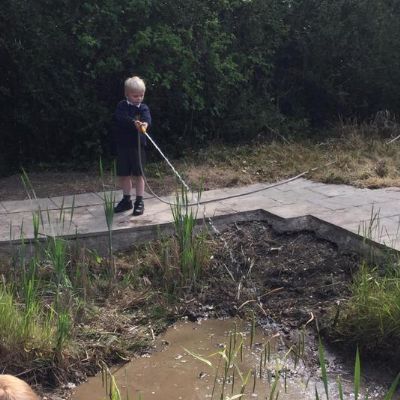 Today, we filled the pond with water. It was great fun!