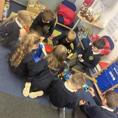 Exploring mass using balance scales.
